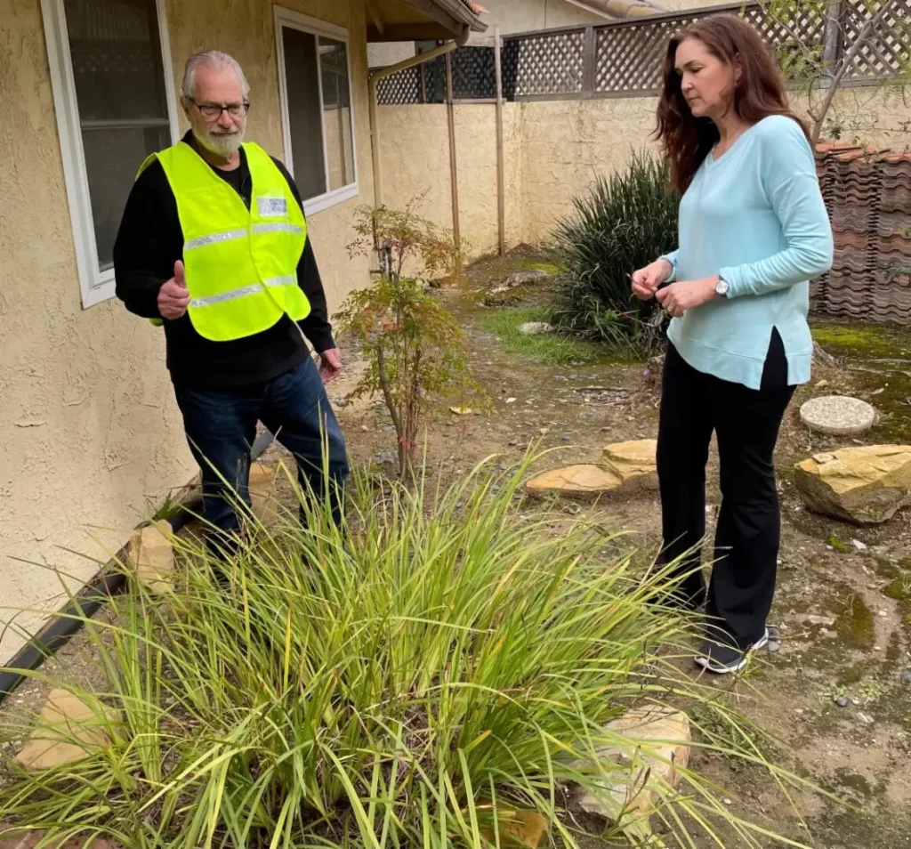 woman receiving instruction from a home hardening expert